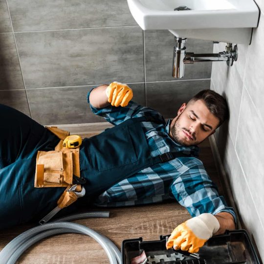 bearded-handyman-lying-on-floor-near-toolbox-in-bathroom.jpg bearded-handyman-lying-on-floor-near-toolbox-in-bathroom.jpg